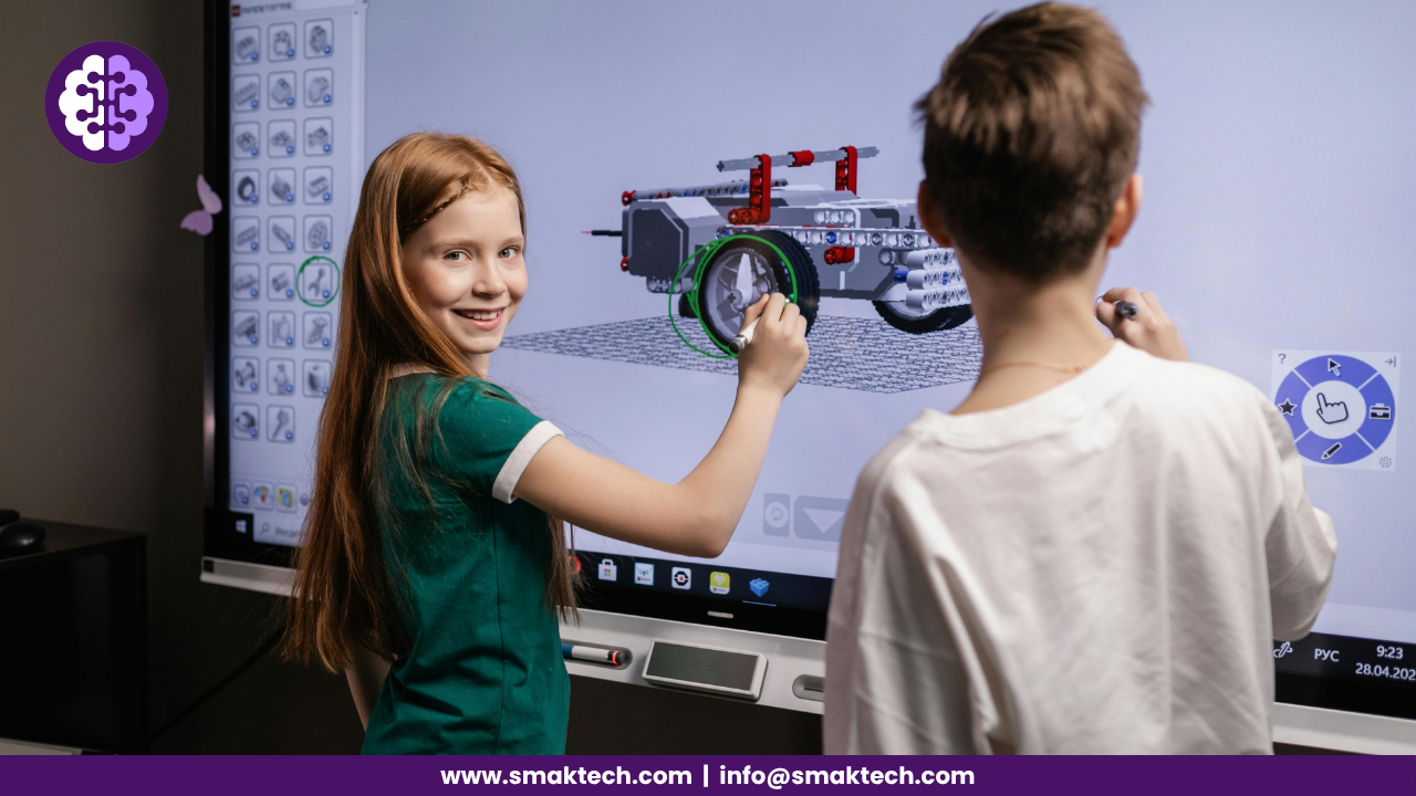 Two children interacting with a digital screen in a classroom setting, learning through technology.