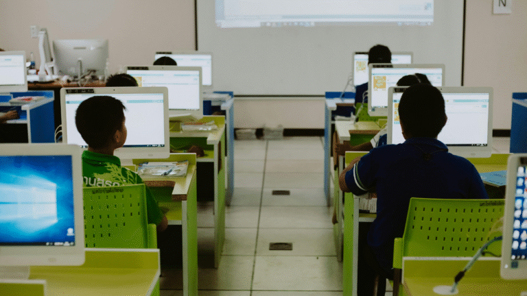 students using computer technology in their classroom for studies