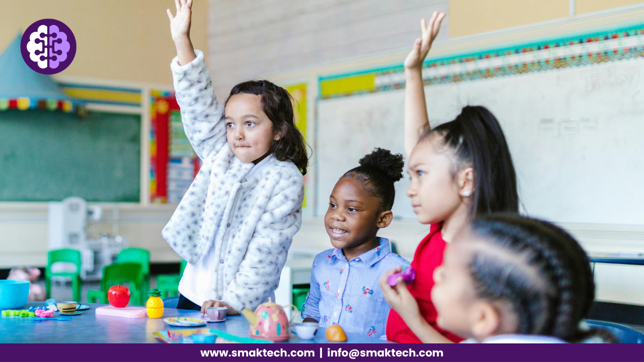 Two girls raised their hands in the classroom, which shows the adaptive learning concept.
