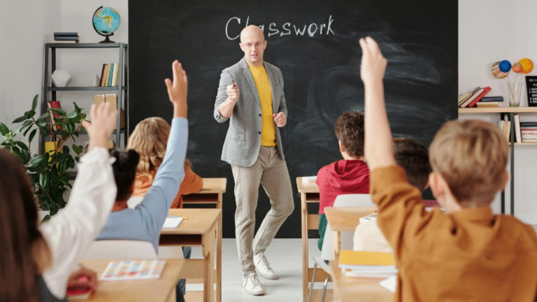 teachers teaching to the students in the clasroom.