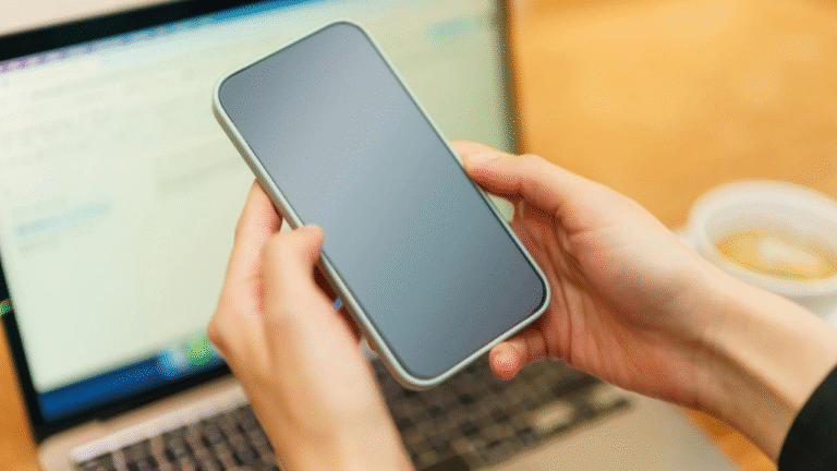 a picture of a smartphone and laptop shong technology for parent-teacher communication