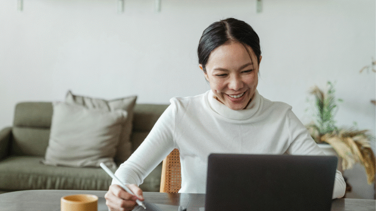 A girl using laptop and ERP system therein